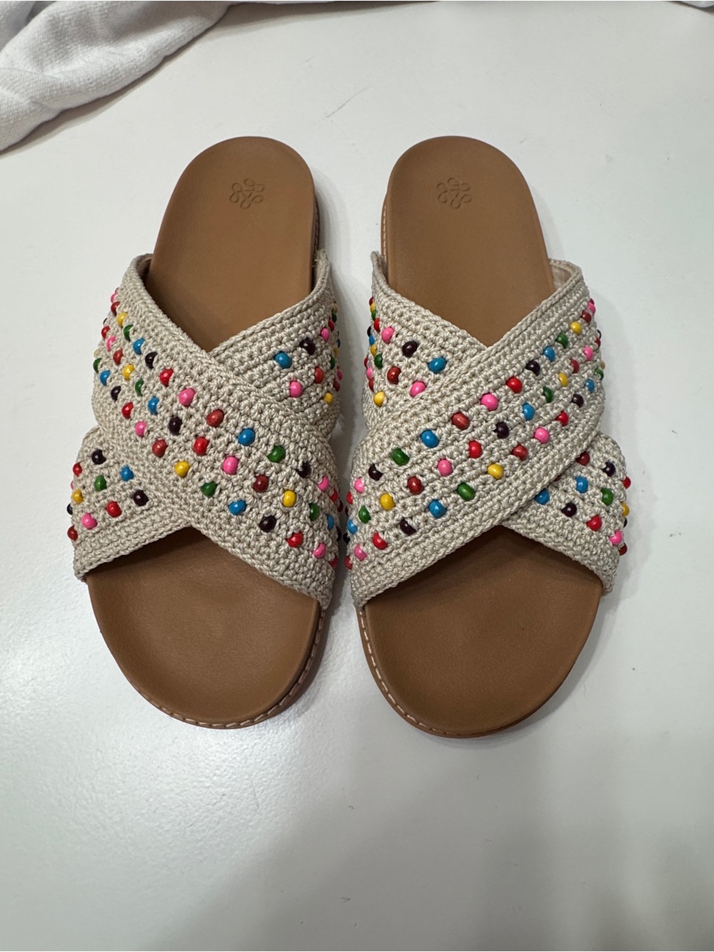 The Sak Crochet Crossover Slide Sandals in Cream with Multicolor Beads